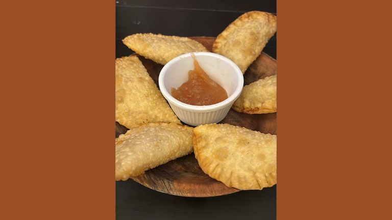 Order the pastel de camarao (fried shrimp pastry) at Ago Bar da Encruza in Santa Teresa.