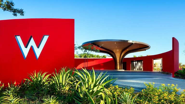 The bright red circular porte-cochere honors the Costa Rican bullfighting tradition of Toros a la Tica.