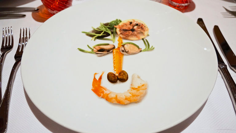 Rudi’s Sel de Mer specialty restaurant showcases Rudi Sodamin’s playful “food faces” charger plates.