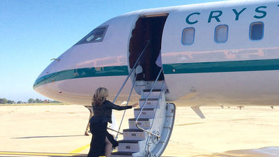 Edie Rodriguez, president and CEO of Crystal Cruises, boards Crystal Luxury Air, the brand’s high-end private charter jet. // © 2016 Emma Weissmann