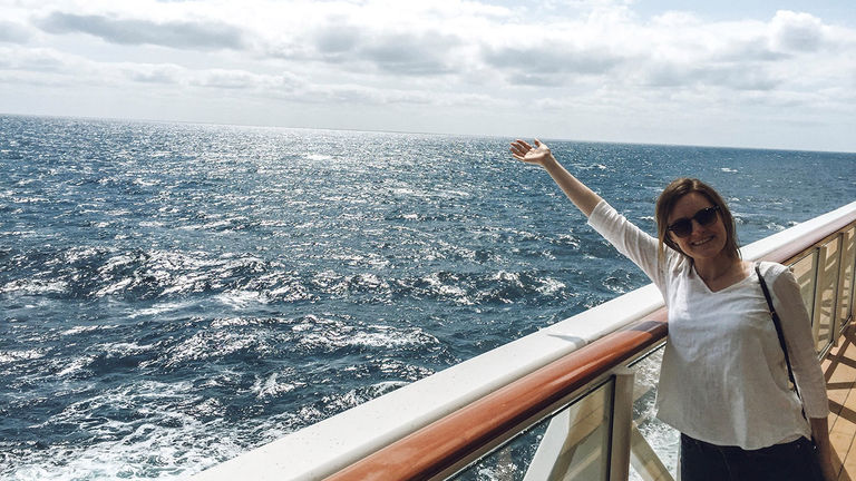 The writer poses at The Waterfront promenade on Deck 8.