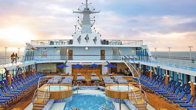 New lounge furniture awaits in Regatta’s pool area. // © 2014 Oceania Cruises