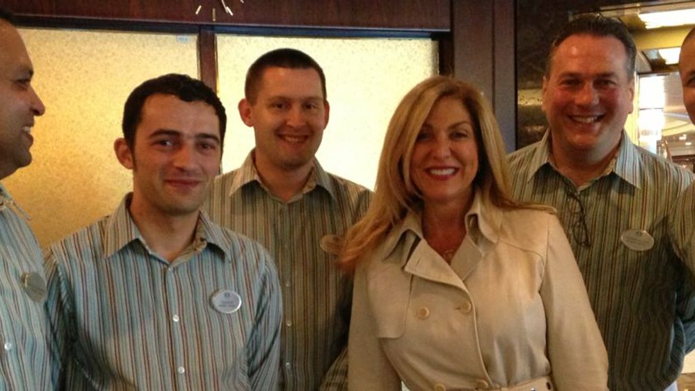 New president and COO of Crystal Cruises Edie Bornstein poses with members of the Crystal crew. // © 2013 Crystal Cruises F