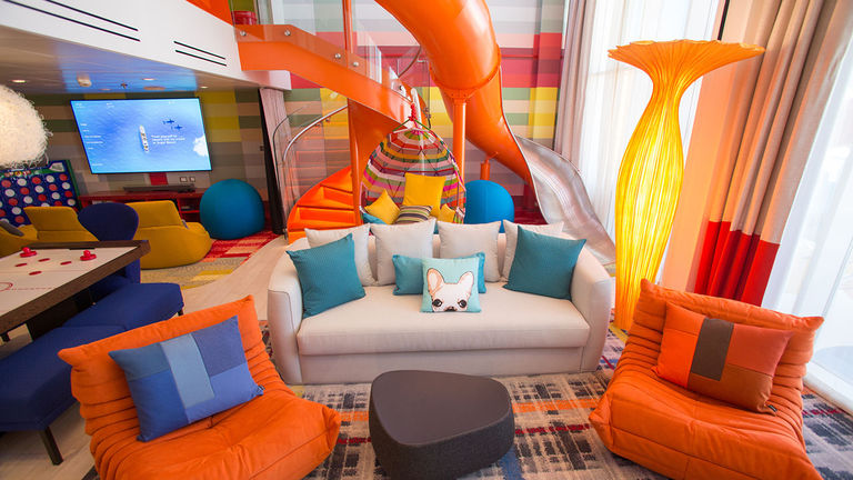 The 1,346-square-foot Ultimate Family Suite can accommodate up to eight people and features a slide between levels.