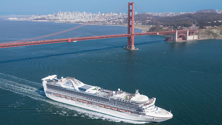 Cruise ships sail under San Francisco’s Golden Gate Bridge.