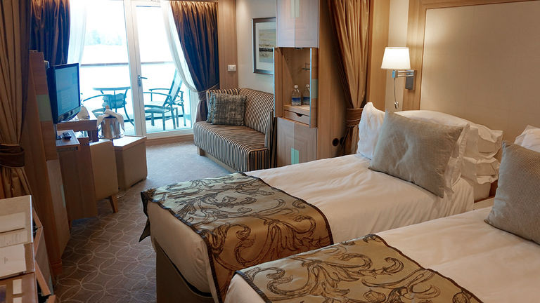 A Veranda Suite features a glass door to a private veranda.