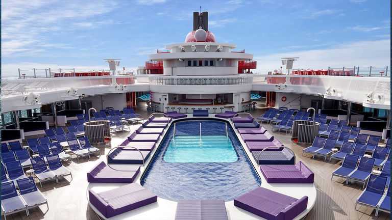 Virgin Voyages’ Scarlet Lady features a stylish pool area.