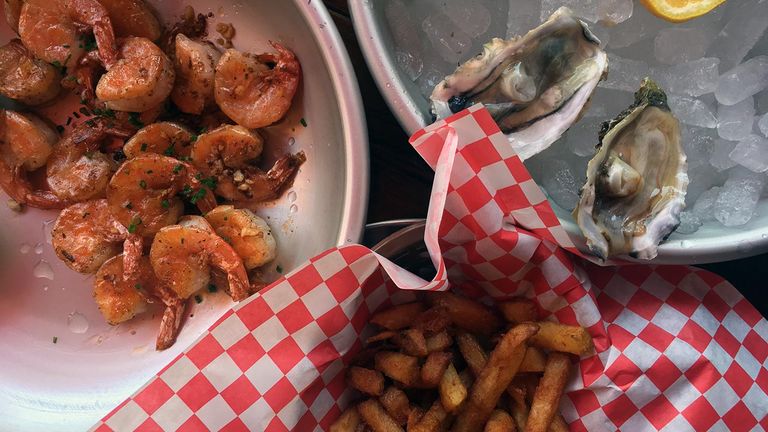 Order shrimp by the pound at Seafood Shack and pair it with oysters and seasoned french fries.