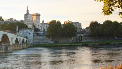 view of Avignon Bridge on the Rhone River with the Papal Palace in the distance // © 2015 iStock 2