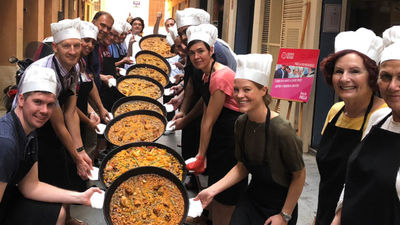Cooking class graduates show off their finished products. // © 2018 Kenneth Shapiro