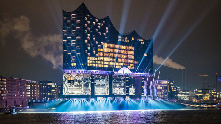 Elbphilharmonie lights up at night.