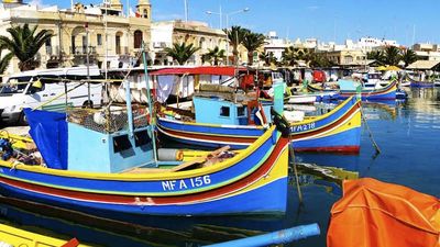 In the seaside village of Marsaxlokk, visitors can see traditional Maltese fishing boats and sample traditional seafood dishes. // © 2015 Visit Malta