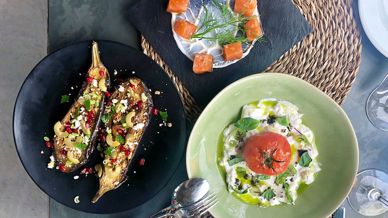 Dine on the outdoor patio of Bodegas Binifadet, a family-owned winery.