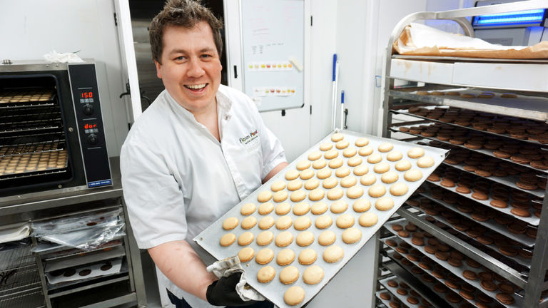 Florian Poirot poses with a tray of macarons at his namesake shop, Florian Poirot, in York. Florian Poirot poses with a tray of macarons at his namesake shop, Florian Poirot, in York.