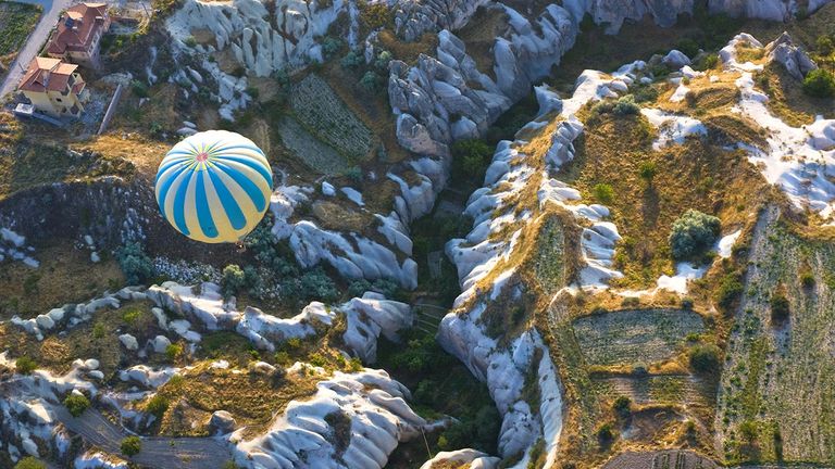 Hot-air balloon rides are must do for visitors traveling to Turkey’s Cappadocia region, known for its lunar-like landscapes.