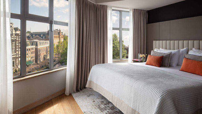 Book clients in a guestroom or suite with a canal view.