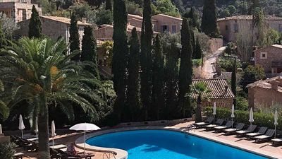 Guests at Belmond La Residencia's main swimming pool also enjoy views of the town of Deia. // © 2017 Ken Shapiro