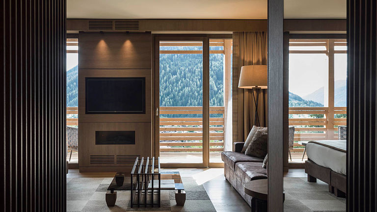 Guestrooms look out into the valley that leads down to Italy’s Lake District.