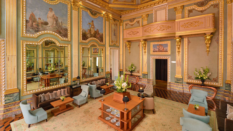 The living room exemplifies the palace’s baroque style.