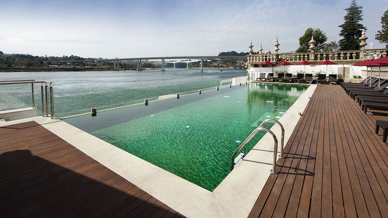 The property’s pool features a modern design aesthetic.