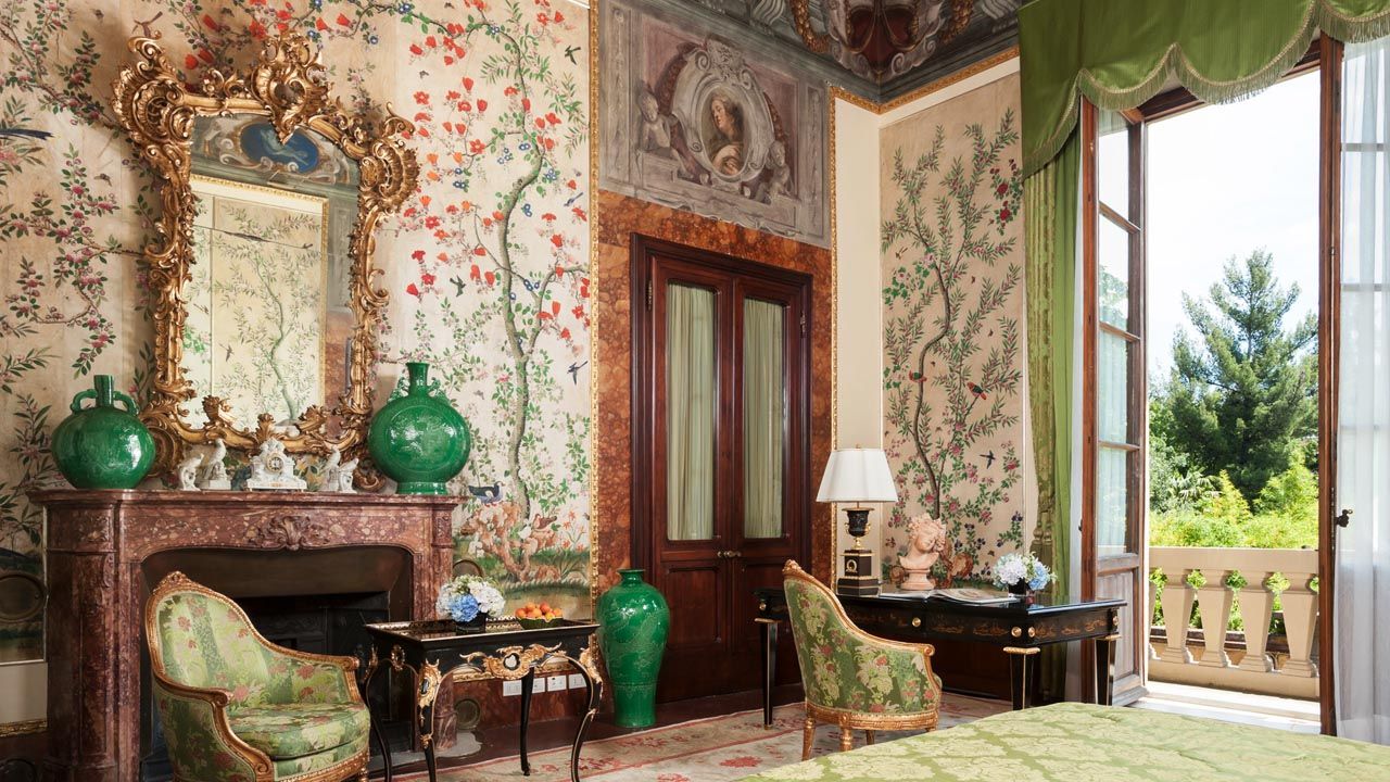 Four Seasons Hotel Firenze’s Volterrano Suite features a 17th-century fresco and 19th-century wallpaper.
