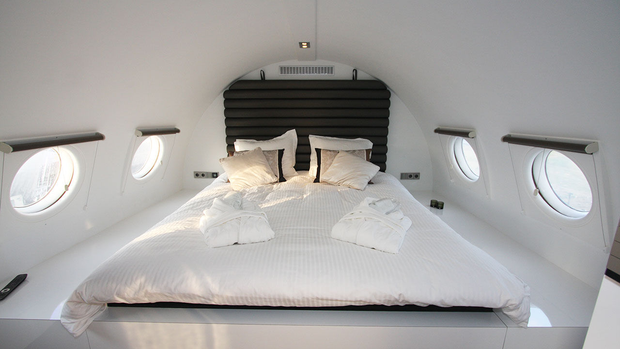 Travelers can sleep inside a 1960 airplane when staying at Vliegtuigsuite Teuge.
