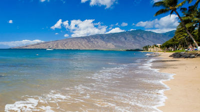 Kihei offers guests access to watersports such as stand-up paddleboarding. // © 2015 Maui Visitors and Convention Bureau 2