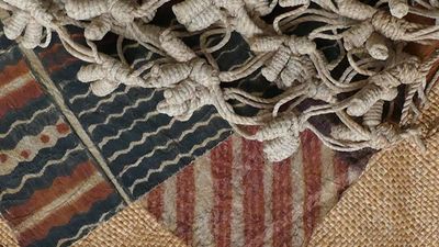Hawaiian pattern and design were incorporated into daily life, exemplified here in printed barkcloth, knotted nets and a plaited mat. // (C) 2017 Bernice Pauahi Bishop Museum