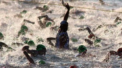 Almost 2,000 triathletes begin the 2.4-mile swim at the Ironman World Championship triathlon, held in Kailua-Kona, Hawaii. // © 2014 JOC Deborah Carson 2