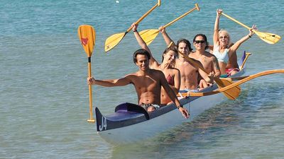 Guests experience outrigger canoe thrills during Aloha Days at the Beach. // © 2016 Ocean Sports