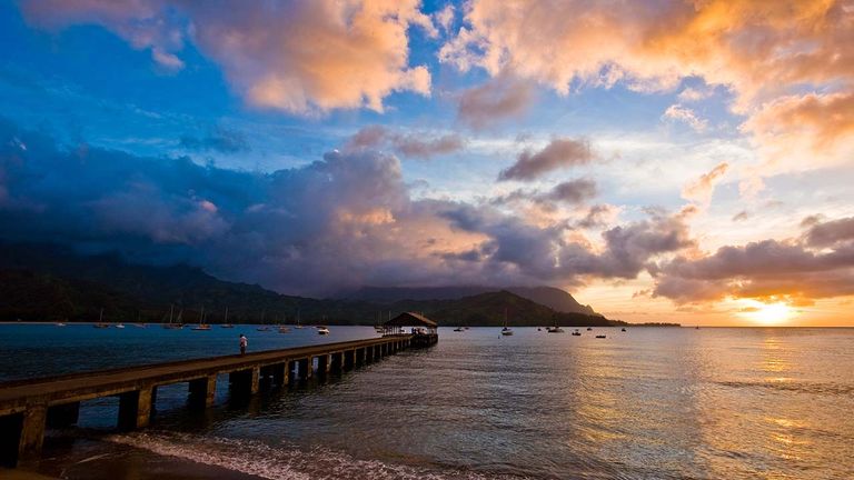 Hawaii’s charm, shaped by photogenic locations such as Kauai’s Hanalei Bay (pictured here), remains attractive to North American travelers.