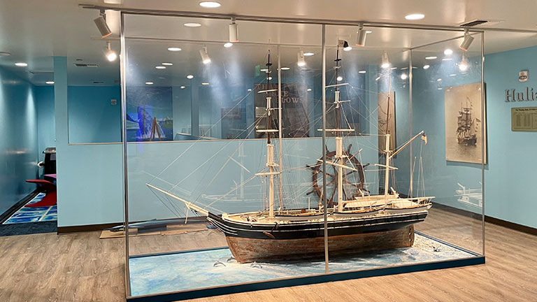 A replica of a whaling ship is among the center’s exhibits.