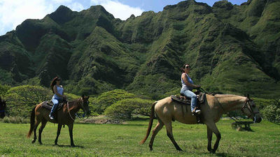 Horseback tours are one of the many eco-friendly offerings at Kualoa, on Oahu's windward side. // © 2015 Kualoa