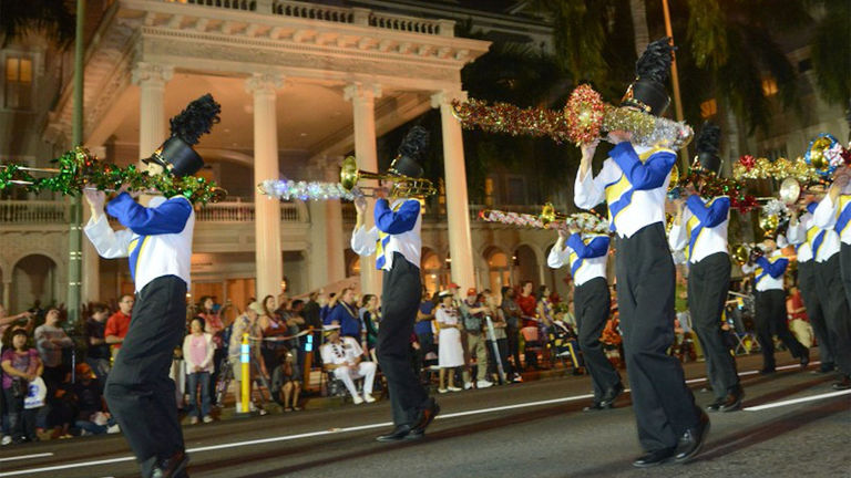 On the day after Thanksgiving, the Waikiki Holiday Parade honors service members and veterans with marching bands and colorful floats.