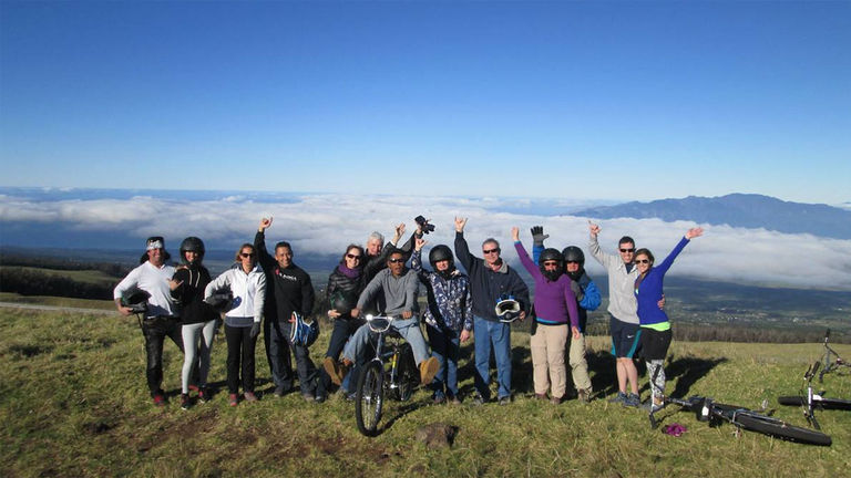 After a thrilling sunrise at the top of Haleakala, clients glide back down the volcano with Bike It Hawaii.