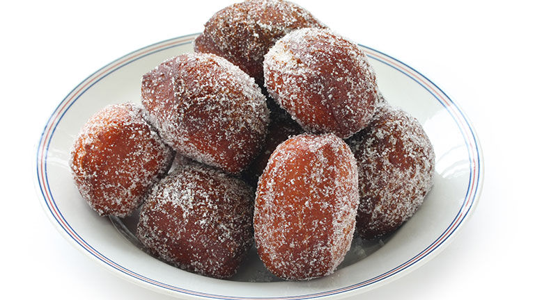 Malasadas are a sugarcoated fried donut.