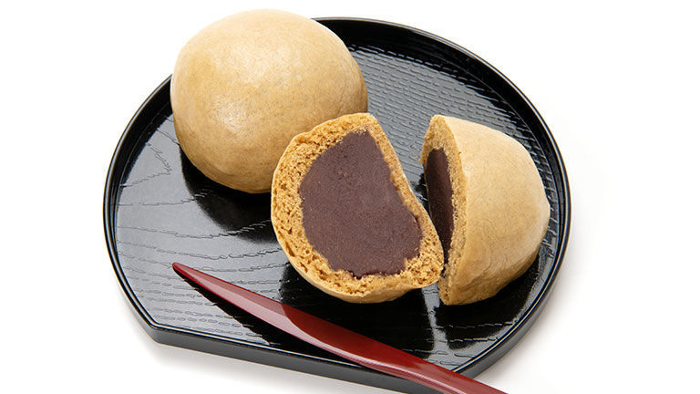 Traditionally, manju is a dough bun filled with sweet bean paste.