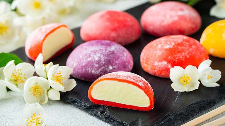 Mochi ice cream has a soft outer rice cake shell and is filled with ice cream.