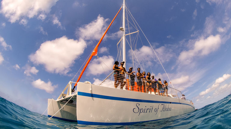 The upgraded Spirit of Aloha regales guests with splashy, classy catamaran sails.