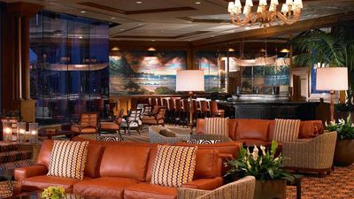 The elegant St. Regis Bar on Kauai capitalizes on views of Hanalei Bay. // © 2015 The St. Regis Princeville Resort