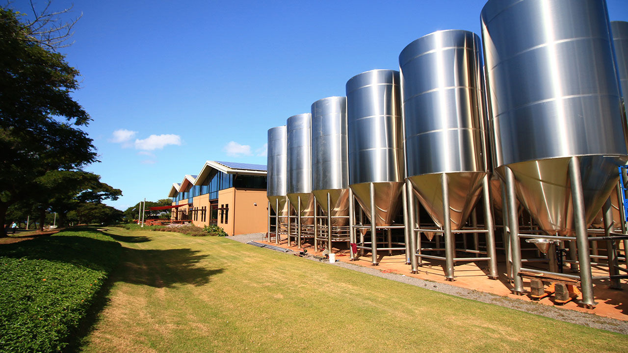 Large fermentation tanks identify Maui Brewing Company in Kihei.