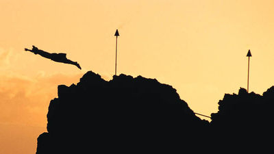 A cliff diver honors the last chief of Maui with a nightly sunset cliff dive off of Black Rock on Kaanapali Beach. // © 2013 Sheraton Maui Resort and Spa F