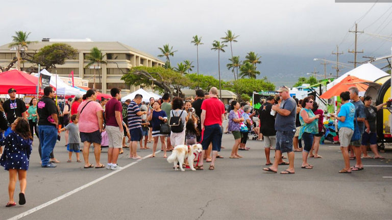 Locals and visitors mingle during the new Maui Sunday Market in Kahului.