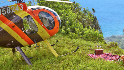 At Turtle Bay Resort, couples can book romantic hotel extras such as a private helicopter tour over Oahu's North Shore. // © 2015 Turtle Bay Resort