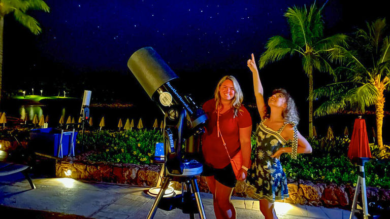 Astronomer Greg McCartney uses powerful computerized telescopes for his star shows.