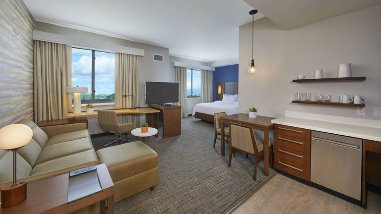 Accommodations at the all-suite hotel come with creature comforts such as a full kitchen, a workspace and a big-screen TV.