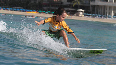 All ages enjoy Duke’s OceanFest, whether they are hanging ten or cheering from shore.