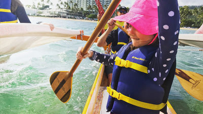 Clients get a hands-on lesson in Polynesian canoe paddling with Holokino Hawaii.
