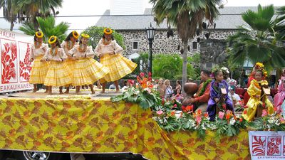 Floats and hula dancers delight during the King Kamehameha Day Celebration parade.