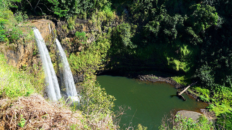 Tourist attractions, such as Wailua Falls on Kauai, are seeing far fewer visitors.
